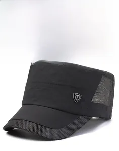 Close-up of black breathable mesh and metal shield ornament on flat top military sun cap