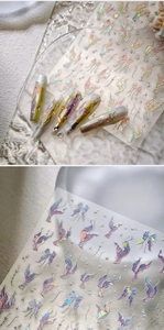 Detailed macro view of 3D aurora butterfly nail stickers with embossed ribbon textures