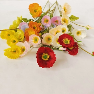Vibrant artificial poppy bouquet in various colors including red and yellow on white background