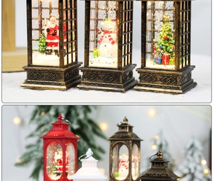 Detail of Christmas lantern snow globe with Santa and swirling glitter effect