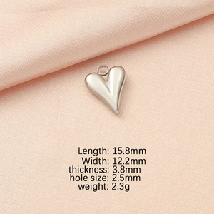 Detail view of heart-shaped stainless steel pendant with precise size measurements