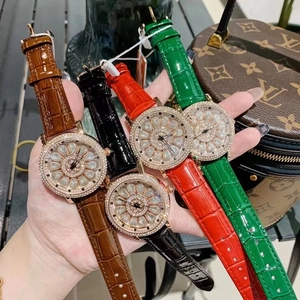 Five luxury rotating watches with crystal-inset dials and colorful crocodile leather straps