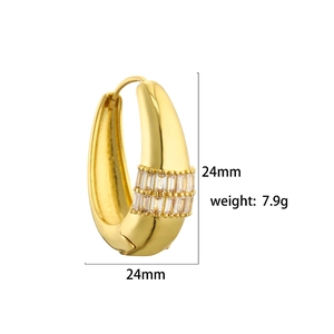 Detailed view of gold hoop earrings with clear crystals and 24mm size dimensions