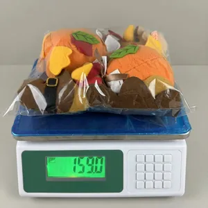 Detail showing the weight of a harvest pumpkin gnome plush measured on a scale