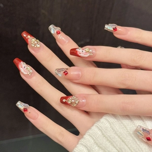 Handmade red and nude gradient press-on nails with Christmas art, pearls, and gold flowers