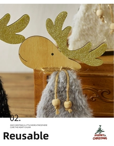 Detail of wooden reindeer ornament with golden glitter antlers and gray faux fur texture
