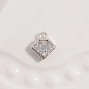 Close-up of geometric S925 sterling silver diamond-shaped pendant with clear cubic zirconia