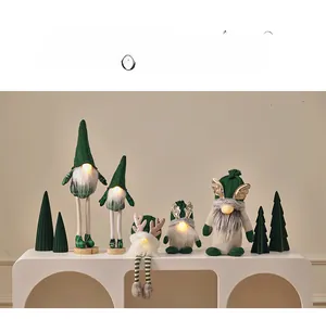 Detailed view of 5 lighted Christmas gnomes with glowing noses and reindeer antlers