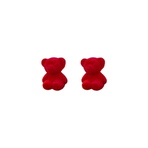 Cute red flocked teddy bear stud earrings with silver needles on a white background
