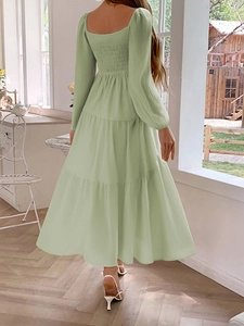 Women's light green backless layered midi dress with long sleeves and tiered skirt details