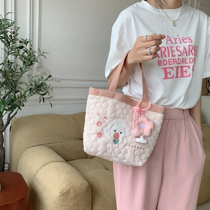 Pink quilted tote bag with floral dog embroidery and soft handle for daily commute