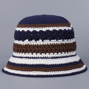 Detail view of handmade crochet bucket hat with navy blue and brown striped hollow patterns