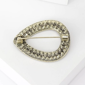Bohemian gold teardrop brooch with textured metal back and secure safety pin clasp