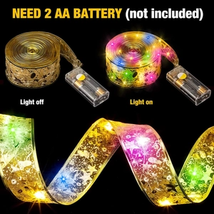 Detail of gold LED ribbon light showing battery box and color lights on black background