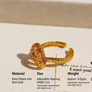 French vintage gold plated knot ring with thick woven texture and open band design