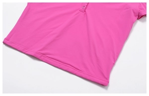 Detail view of pink yoga t-shirt featuring double-needle hem stitching and metal snap button