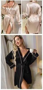 Detail of luxurious satin silk bathrobes with contrast piping and a waist tie closure