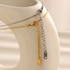 Detail shot of stainless steel necklace clasp and extension chain with 18K gold plating