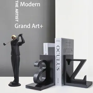 Modern black A-Z alphabet bookends and gold golfer figurine for office shelf decor