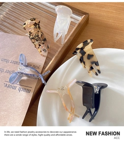 Detail of diverse acetate hair claw clips with tortoiseshell and marble patterns