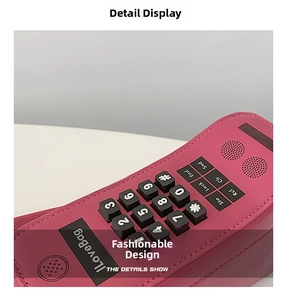 Close-up of retro phone style bag featuring embossed keyboard and I Love Bag plate