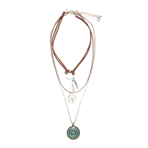 Three-layer bohemian pendant necklace with resin leaf and tree of life charms on white background