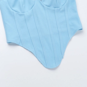 Detail of light blue lace corset top with vertical boning and curved V-shape hemline