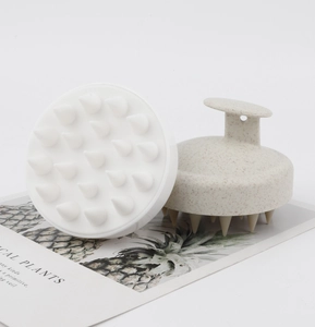 Detail of 19-tooth silicone scalp massager brush with ergonomic handle and hanging hole