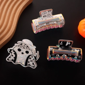 Halloween ghost hair claw set with iridescent finish and BOO prints on black background