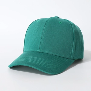 Detail of dark green cotton baseball cap showing 6-panel stitching and curved brim