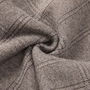 Macro shot of warm brown ribbed knit fabric texture on this casual men's sleeveless vest