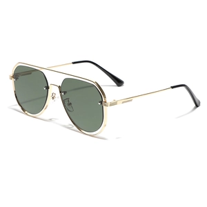 Classic aviator sunglasses with gold metal frame and dark green lenses for men and women