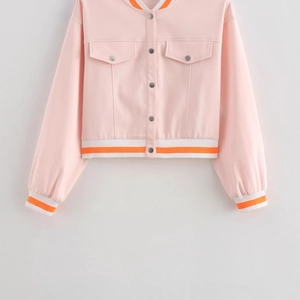 Pink cropped baseball jacket with orange ribbed trim and snap button closure