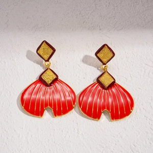 Retro red enamel fishtail fan earrings with golden diamond texture on white background