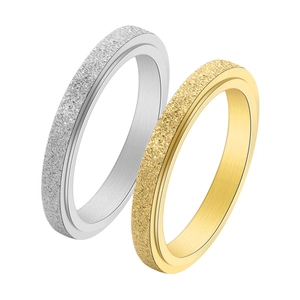 Detail of 2mm matte emery finish silver and gold titanium steel rings with polished inner bands