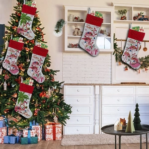 Festive Christmas stockings with flamingo and tree prints for holiday home decoration