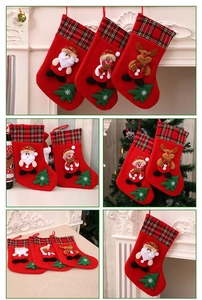 Detail of red Christmas stockings featuring Santa, snowman, and reindeer on a fireplace