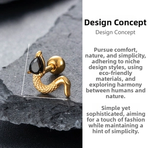 Macro detail of gold snake-shaped ear stud with black zircon and dimensions 0.9x1.04cm