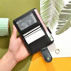 Short fold black canvas patchwork wallet for women featuring multiple card slots and zip pocket