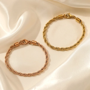 Elegant gold and rose gold twisted rope chain bracelets with lobster clasp on silk