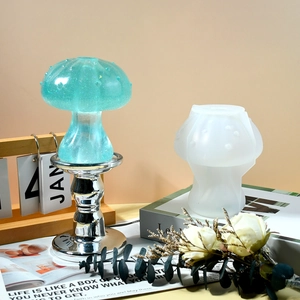 Macro detail of mushroom silicone mold and finished blue resin flower vase on a table