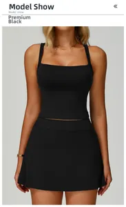 Detail of premium black yoga vest and sports skirt set with slim fit double straps