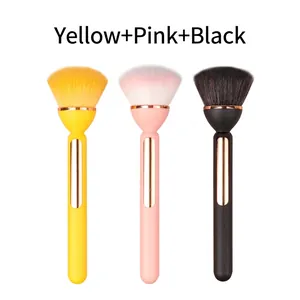 Three gradient makeup brushes with gold trim and soft bristles in yellow, pink and black