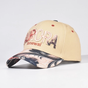 Detail of Aurora embroidery on a khaki baseball cap with a marble-patterned brim