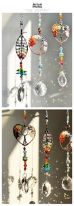 Detail of tree of life suncatchers with crystal prisms and Made with Love charms