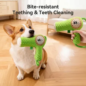 Green hairdryer-shaped dog squeaky toy in durable corn velvet fabric for teeth cleaning