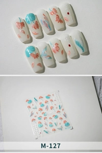 Detail of M-127 lotus nail art stickers with 3D floral effects and pearl finish textures