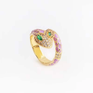 Detailed close-up of a snake ring with purple enamel and zircon inlay on gold-plated copper