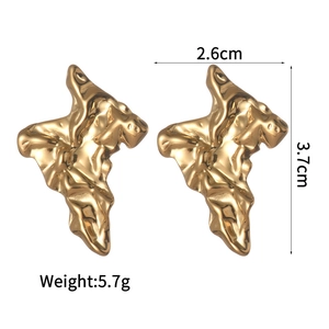 Detail showing 3.7cm height and 2.6cm width of irregular hammered gold stud earrings