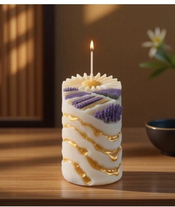 Detailed view of cylindrical lavender candle with floral carvings and gold wave patterns